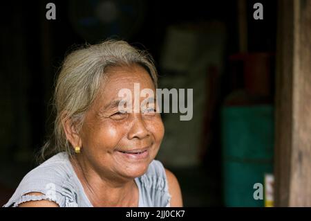 Chini, Malaysia: 19 April 2022 - A close-up of a single indigenous woman smiling Stock Photo