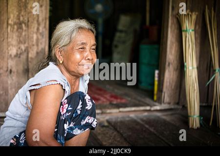 Chini, Malaysia: 19 April 2022 - A close-up of single indigenous woman smiling Stock Photo