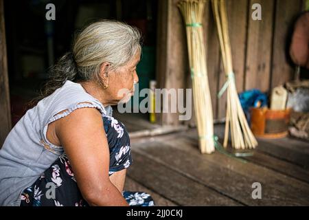 Chini, Malaysia: 19 April 2022 - A close-up profile of a single indigenous woman Stock Photo