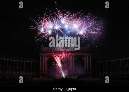 Brussels, Belgium. 21st July, 2022. Fireworks explode over the arch of Park of Fiftieth Anniversary during the Belgian National Day celebrations in Brussels, Belgium, on July 21, 2022. Credit: Zheng Huansong/Xinhua/Alamy Live News Stock Photo