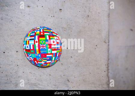 Circle with flags of several countries in bright colors, on a concrete background Stock Photo