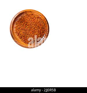 Organic bee pollen grains in the wooden bowl Stock Photo