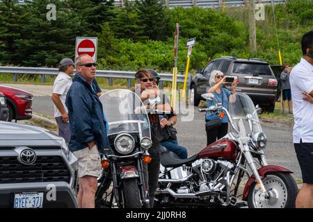 Aurora, Canada. 21st July, 2022. Two members of the Hells Angels club looks on as one of their members got an accident. Hundreds of Hells Angels members rolled through York Region towards Toronto for a memorial procession. The procession is in honor of a fallen member of the outlaw Hells Angels Motorcycle Club. Credit: SOPA Images Limited/Alamy Live News Stock Photo