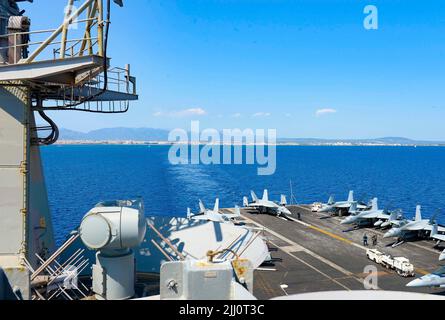 220719-N-FB730-1029 PALMA DE MALLORCA, SPAIN (July 19, 2022) The Nimitz-class aircraft carrier USS Harry S. Truman (CVN 75), pulls out of Palma de Mallorca, Spain following a scheduled port visit , July 19, 2022. The Harry S. Truman Carrier Strike Group is on a scheduled deployment in the U.S. Naval Forces Europe area of operations, employed by U.S. Sixth Fleet to defend U.S., allied and partner interests. (U.S. Navy photo by Mass Communication Specialist 3rd Class Justin Woods) Stock Photo