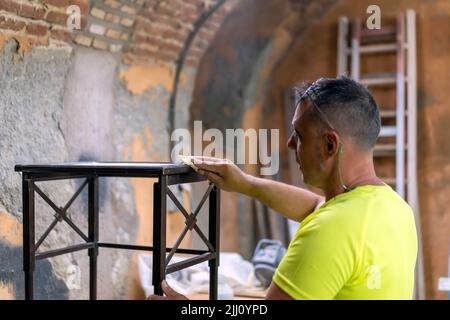 master carpenter preparing a table to restore Stock Photo