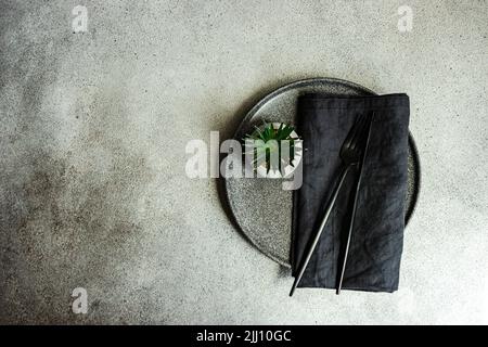 Minimalistic table setting on concrete background Stock Photo