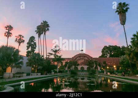 San Diego, CA. 22nd July, 2022. The pink sunset at the Botanical Building and lilly pond at Balboa Park in San Diego, California on Thursday, July 21st, 2022 (Credit Image: © Rishi Deka/ZUMA Press Wire) Stock Photo