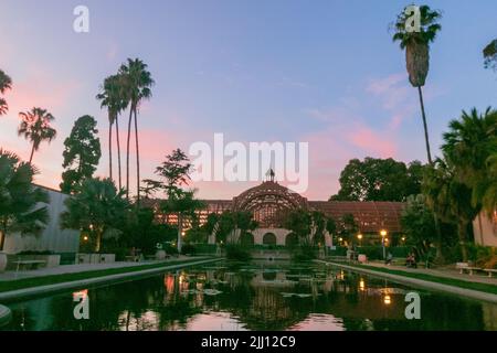 San Diego, CA. 22nd July, 2022. The pink sunset at the Botanical Building and lilly pond at Balboa Park in San Diego, California on Thursday, July 21st, 2022 (Credit Image: © Rishi Deka/ZUMA Press Wire) Stock Photo