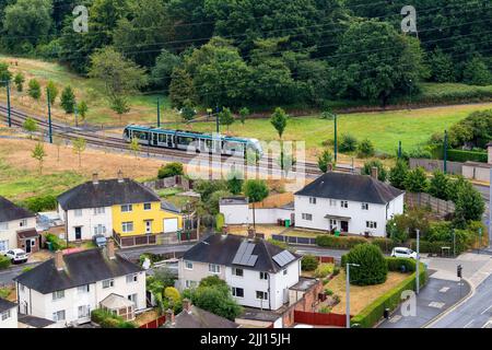Aerial image of a tram coming in to Clifton, captured from the roof of Southchurch Court, Nottinghamshire England UK Stock Photo