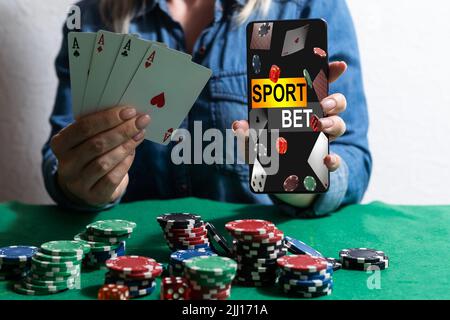 inscription your bet wins on a smartphone on the poker table. Stock Photo