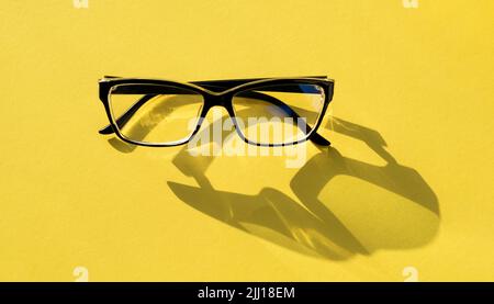 Glasses isolated on yellow background Stock Photo