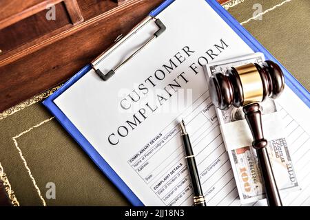 Complaints. Wooden gavel and books in background. Law and justice concept. Stock Photo