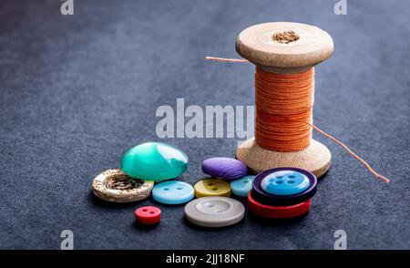 Sewing buttons and thread spool Stock Photo