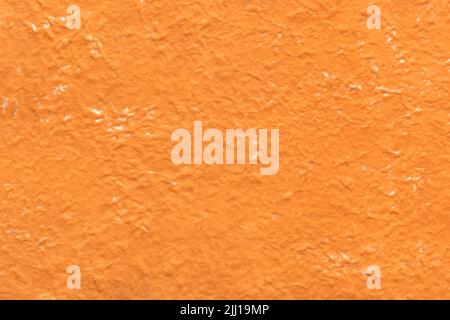 Orange crumpled paper texture background, abstract backdrop Stock Photo