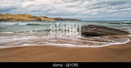 Waves on the beach at Strathy Bay on the north coast of Scotland Stock Photo