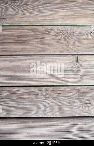 Old brown wood background made of dark natural wood in grunge style. The view from the top. Copy space. Stock Photo