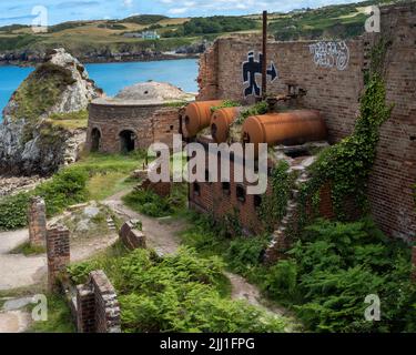 Grafitti and Victorian industrial heritage at Porth Wen, Anglesey, Wales, UK Stock Photo
