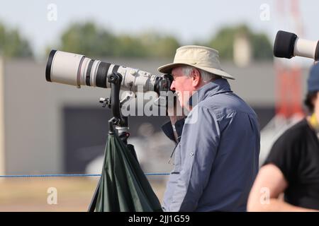 Photographer using a long camera lens on a tripod, Royal International Air Tattoo, Fairford, Gloucestershire Stock Photo