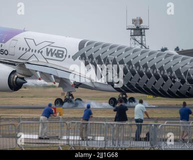 Farnborough International Airshow, 18 July 2022, Hampshire, England, UK. Airbus A350 X WB F-WWCF touches down on the runway after a demonstration flight at the Trade Airshow. Stock Photo
