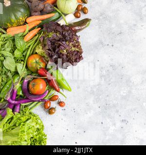 Different vegetables on cement background. Healthy eating concept. Top view. Stock Photo