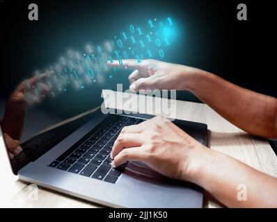 People are using 010101 binary decoder keyboard programmers to develop tech industry and online business from scratch. Stock Photo