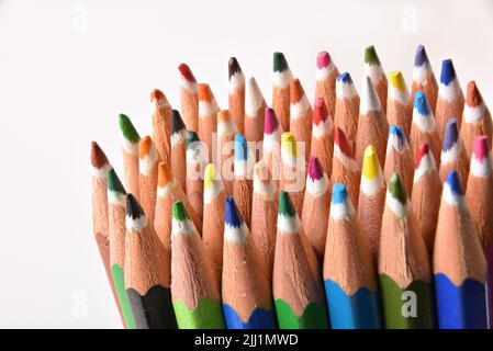 Detail of group of crayon tips on white background. Horizontal composition. Stock Photo