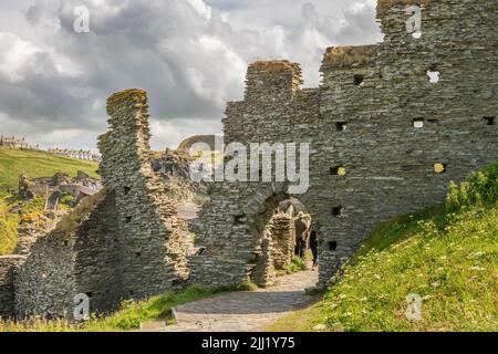 Tintagel Castle is a medieval fortification on top of the peninsula of Tintagel Island adjacent to the village of Tintagel in North Cornwall. Stock Photo