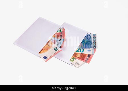 euro banknotes in open envelopes isolated on white, bribe, shadow economy and corruption concept Stock Photo