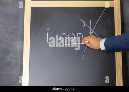 Hand writing with chalk on a blackboard the words I can. Stock Photo