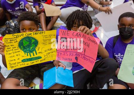 July 20, 2022. Boston, MA. Activists and concerned citizens from 350 Mass marched through the Massachusetts State House to exert pressure get a veto-p Stock Photo