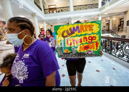 July 20, 2022. Boston, MA. Activists and concerned citizens from 350 Mass marched through the Massachusetts State House to exert pressure get a veto-p Stock Photo