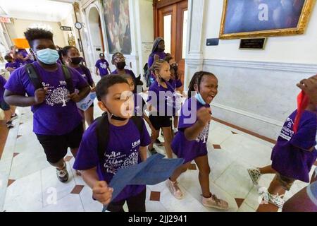July 20, 2022. Boston, MA. Activists and concerned citizens from 350 Mass marched through the Massachusetts State House to exert pressure get a veto-p Stock Photo