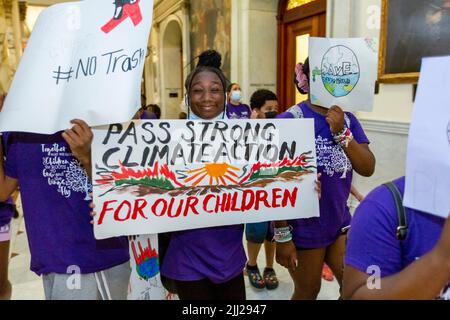 July 20, 2022. Boston, MA. Activists and concerned citizens from 350 Mass marched through the Massachusetts State House to exert pressure get a veto-p Stock Photo