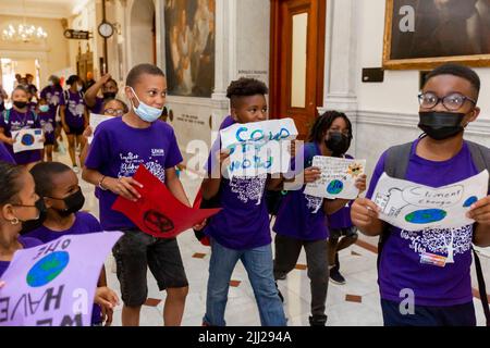 July 20, 2022. Boston, MA. Activists and concerned citizens from 350 Mass marched through the Massachusetts State House to exert pressure get a veto-p Stock Photo