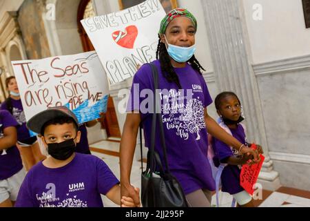 July 20, 2022. Boston, MA. Activists and concerned citizens from 350 Mass marched through the Massachusetts State House to exert pressure get a veto-p Stock Photo