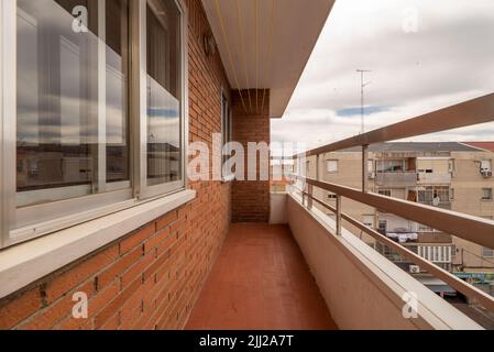 Terrace of an apartment with mud brick walls and views of the city Stock Photo