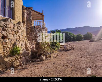 Cottage in a Bedouin Camp on the Sea in Ras Shitan in Oasis in Sinai, Taba desert with the Background of the Sea and Mountains. Stock Photo