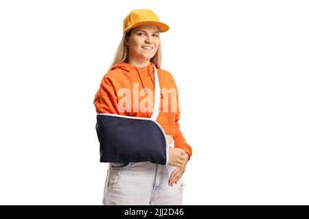 Young female with a broken arm wearing an arm splint isolated on white background Stock Photo