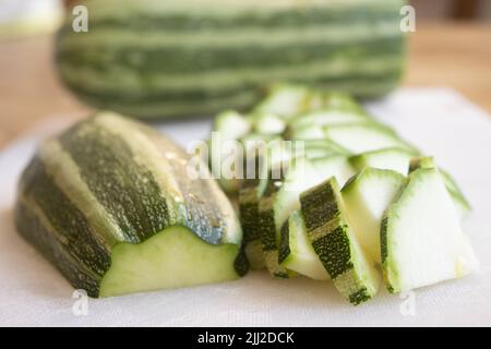 zucchini cut in pieces as ingredient for soup Stock Photo