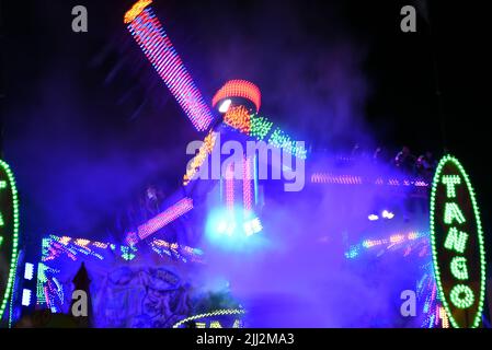 COSTA MESA, CALIFORNIA - 20 JUL 2022: Tango Carnival ride with motion blur at the Orange County Fair. Stock Photo