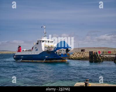 The interisland roll on - roll off ferry Bigga arriving at the ferry terminal at Gutcher on the island of Yell in Shetland, UK. Stock Photo