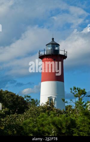 Nauset Lighthouse tower among puffy clouds on a sunny summer day on Cape Cod, in Massachusetts. Stock Photo