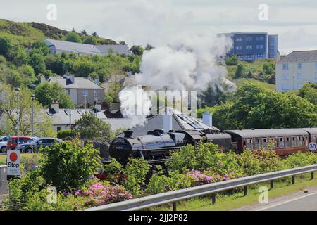 Jacobite steam train 45212 in Mallaig. The Jacobite is a steam locomotive-hauled tourist train service that operates over part of the West Highland. Stock Photo