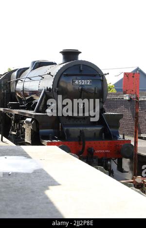 Jacobite steam train 45212 in Mallaig. The Jacobite is a steam locomotive-hauled tourist train service that operates over part of the West Highland. Stock Photo