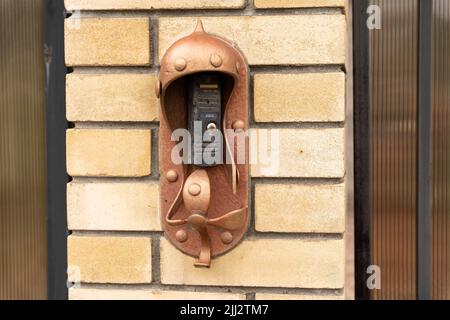 intercom panel with a video camera on the brick fence of private house Stock Photo
