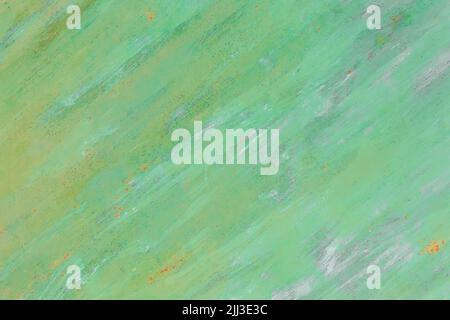 Green paint on abstract metal surface pattern old steel texture outdated background obsolete. Stock Photo