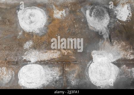 White spots paint stains abstract pattern design on dark metallic rusty surface steel background blank empty. Stock Photo