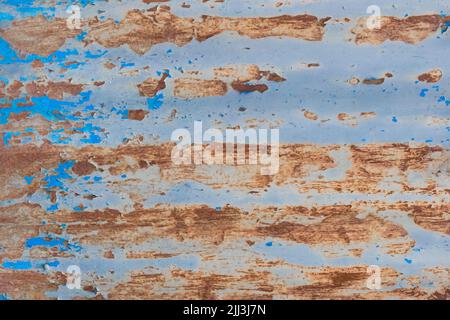 Old Rusty Peeling Paint Metal Corrugated Fence Steel Texture Background Rust Corrosion. Stock Photo