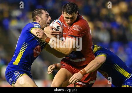 Sam Wood (24) of Hull KR is tackled by George Williams #7 and Jake Wardle #34 of Warrington Wolves in, on 7/22/2022. (Photo by Craig Thomas/News Images/Sipa USA) Credit: Sipa USA/Alamy Live News Stock Photo