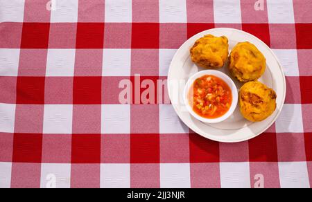 Potatoes stuffed with meat - Colombian fried street food Stock Photo
